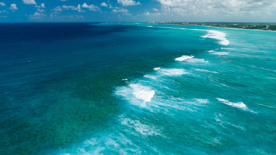 Aerial view of seascape against sky