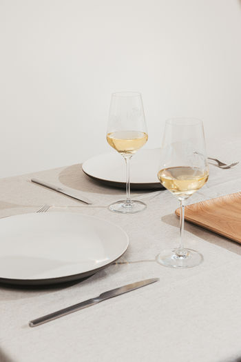 Close-up of wineglasses on table