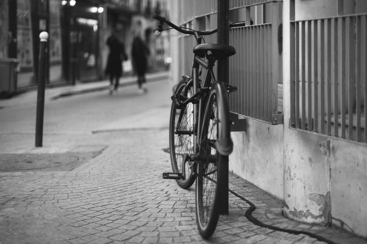 Bicycle parked on sidewalk