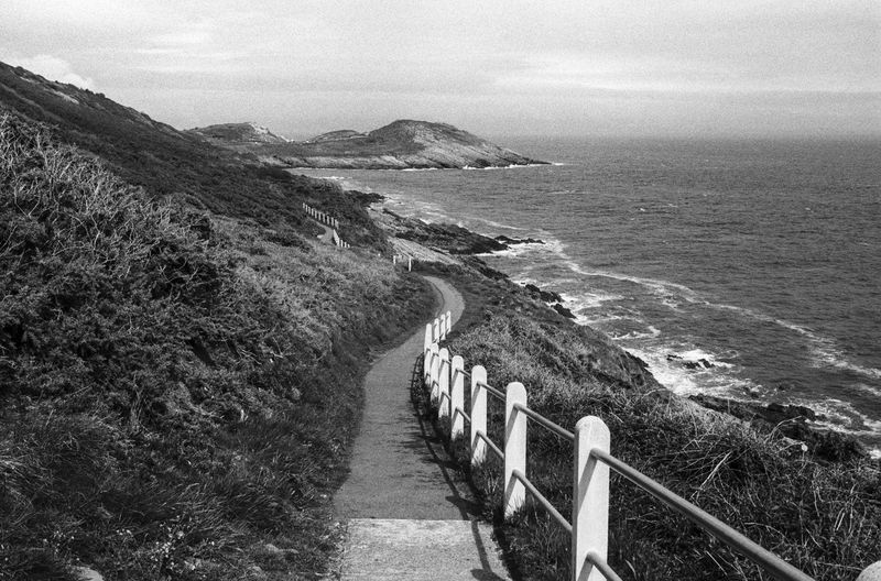Empty walkway by sea