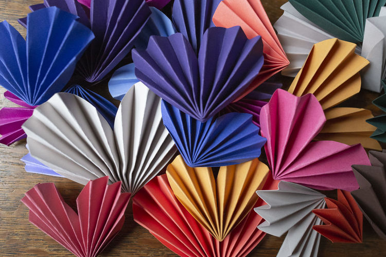 High angle view of multi colored umbrellas on table