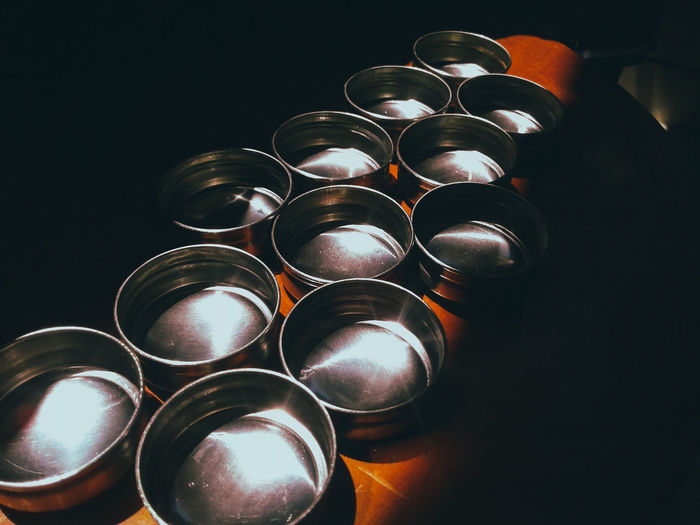 High angle view of bowls with water on table