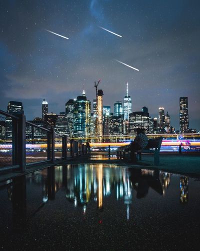 Illuminated buildings in city at night