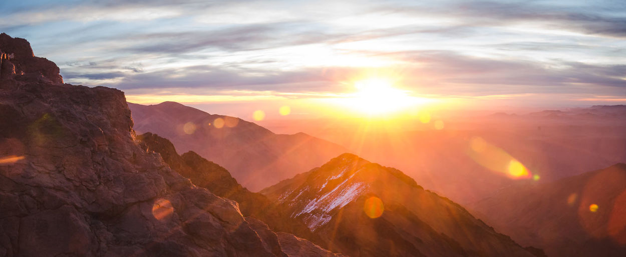 Scenic view of mountains against sky during sunset