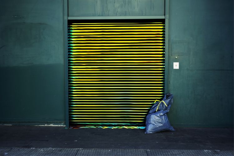 Garbage against closed shutter