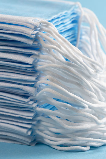 Close-up of blue stack over sea against white background