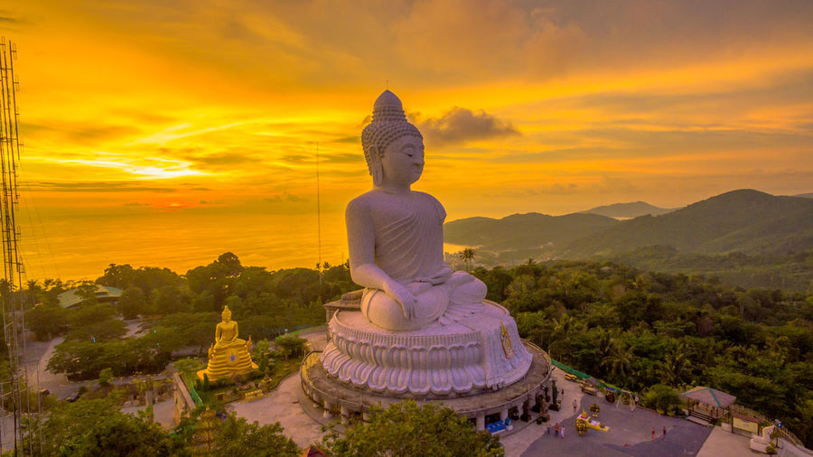 Statue of temple against sky during sunset