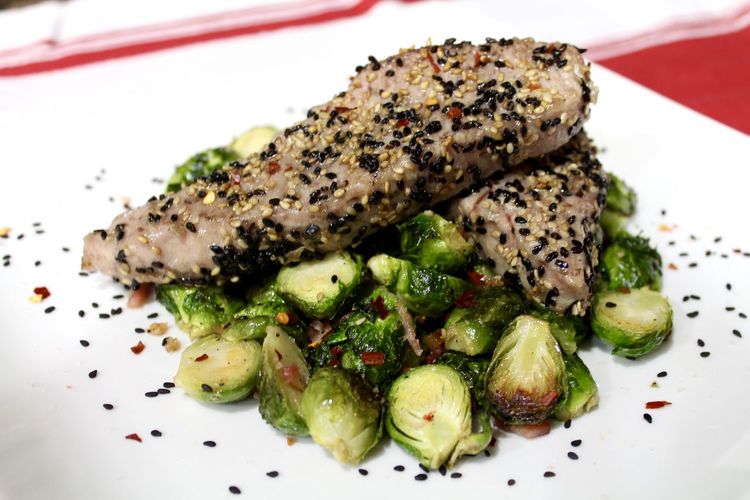 Close-up of tuna and brussels sprouts served in plate
