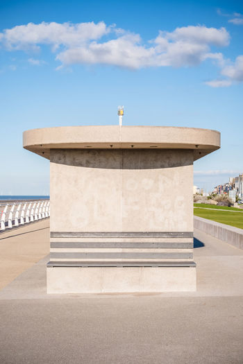 Concrete shelter at seaside against clear blue sky