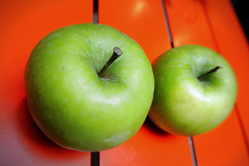 Close-up of granny smith apples on table