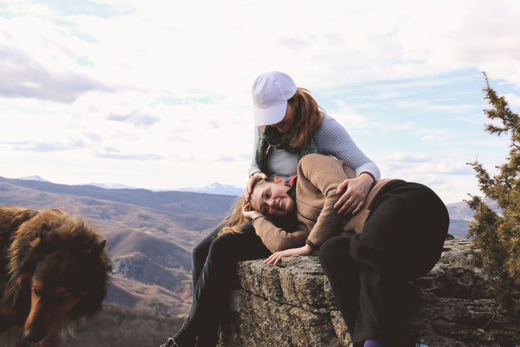 Mother and daughter spending leisure time on mountain