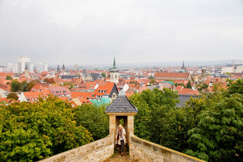 High angle view of woman on terrace against cityscape