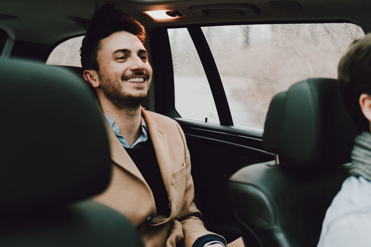 Young couple sitting in car