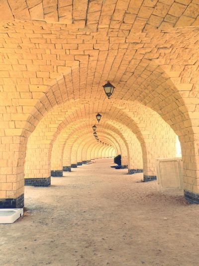 Arched passage with electric lamps