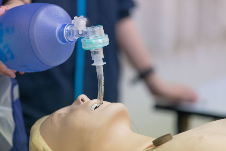 Cropped image of person learning cpr in hospital