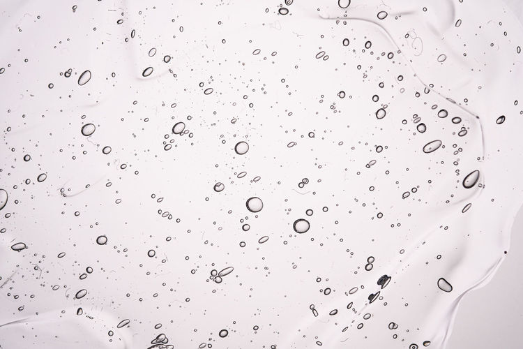 The texture of a thick cosmetic gel on a neutral background.