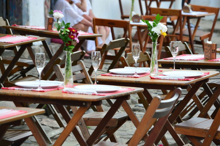 Empty chairs and table at restaurant