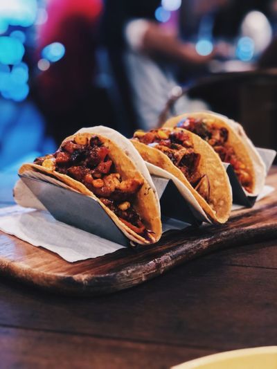 Close-up of tacos in tray on table