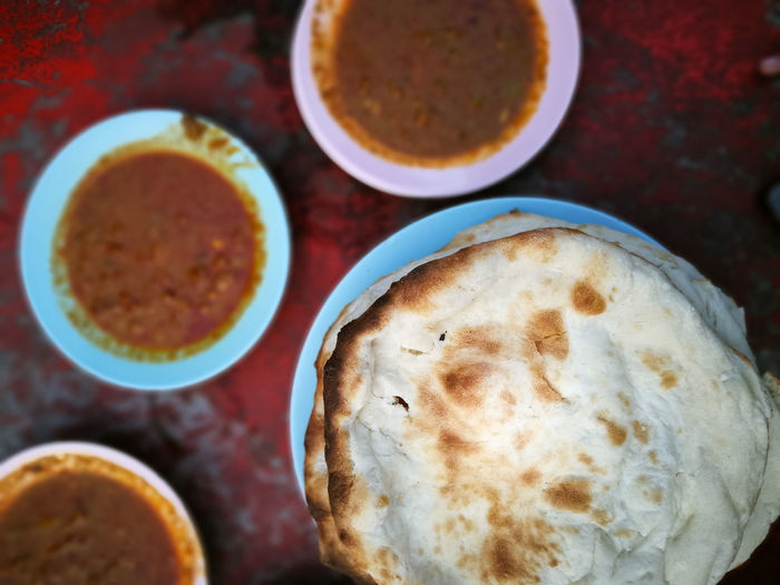 Indian main course food served with baked flat bread also known as naan or roti nan, selective focus