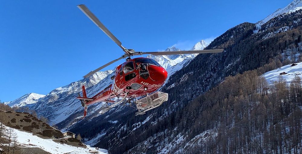 Air zermatt helicopter with mountain background