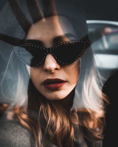 Portrait of beautiful woman in car