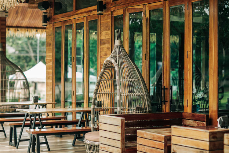 Empty chairs and tables in restaurant
