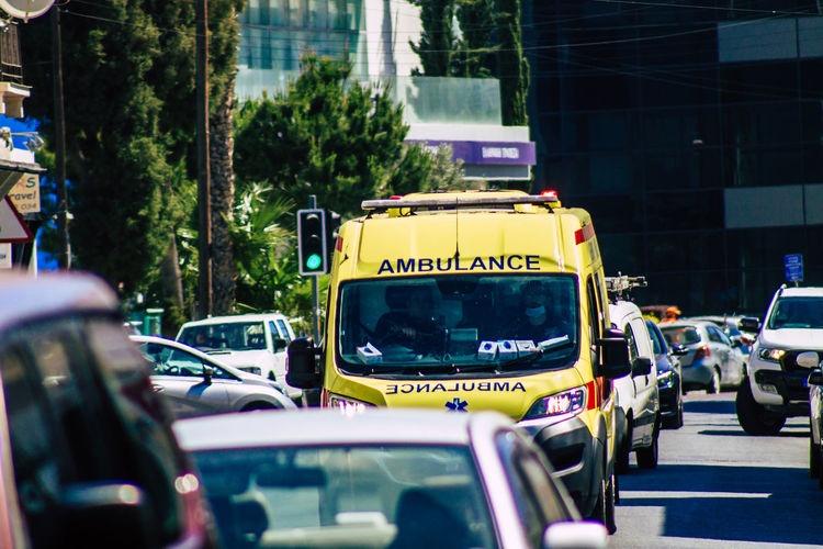 Ambulance on road in city