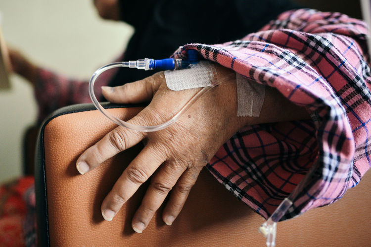 Close-up of patient hand with iv drip