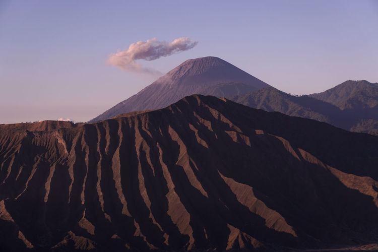 Mount semeru with a beautiful cloud crown and foreground bromo national park area, indonesia.