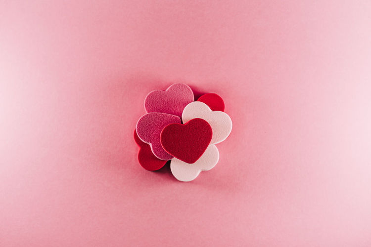 Close-up of heart shape against pink background