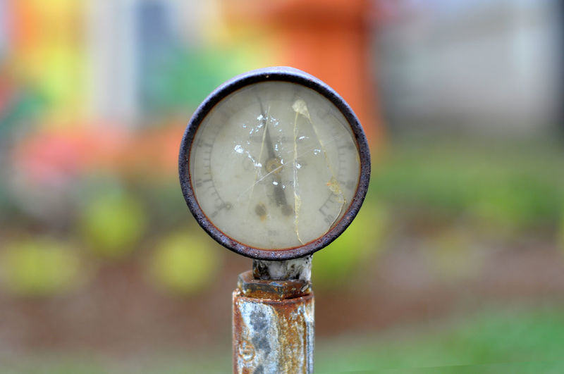 Close-up of pressure meter against blurred background