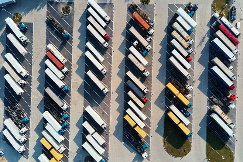 Top view parking lot with parked trucks
