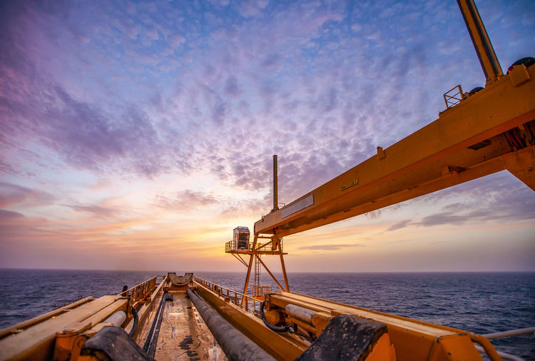 Offshore drilling during sunset in the gulf of mexico