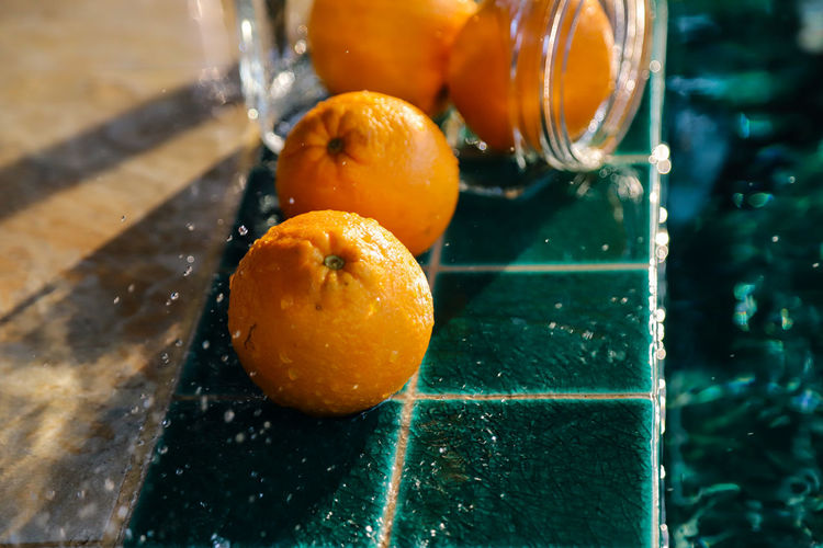 High angle view of orange fruit in water