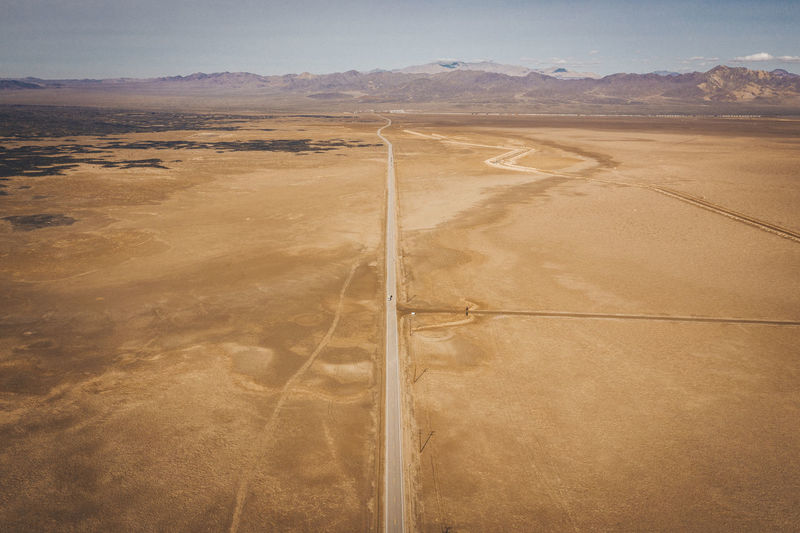 A lonely road through the californian desert from above