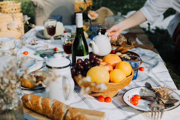 High angle view of food and drink on table in yard