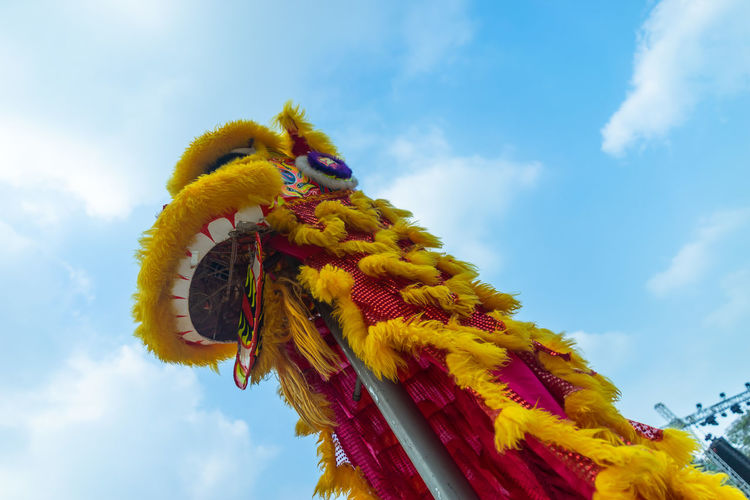 Low angle view of costume against sky