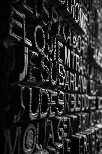 Full frame shot of text carved on wall in sagrada familia