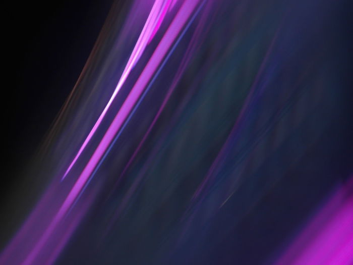 Full frame shot of light trails against black background
