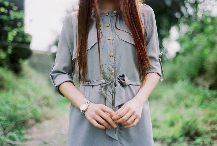 Midsection of in casual clothing woman with long hair