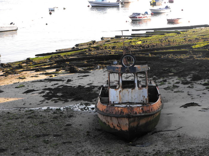 Abandoned boat at beach