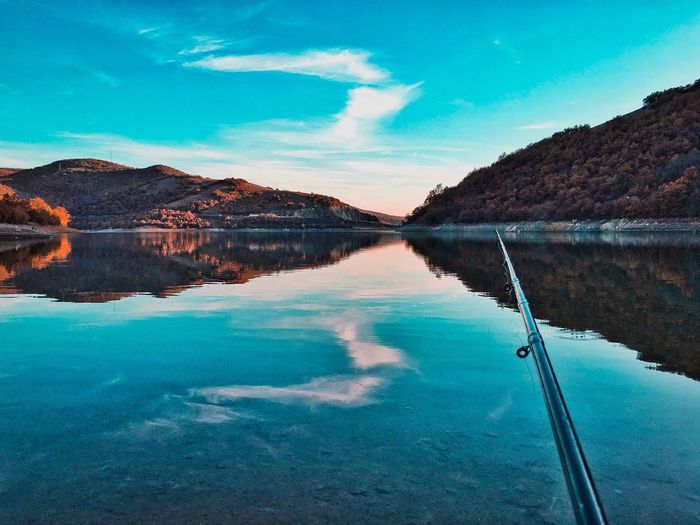 Scenic view of lake against blue sky