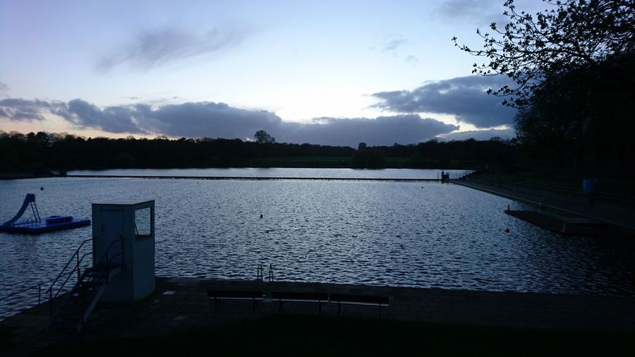 Scenic view of lake against sky during sunset