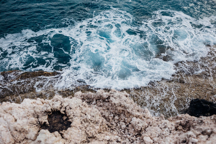 Sea waves splashing on rocks