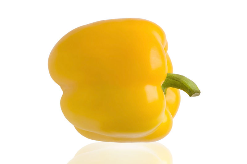 Close-up of yellow bell pepper against white background