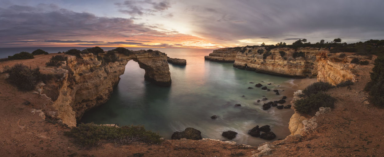 Sunset in algarve cliffs in panoramic from aerial view