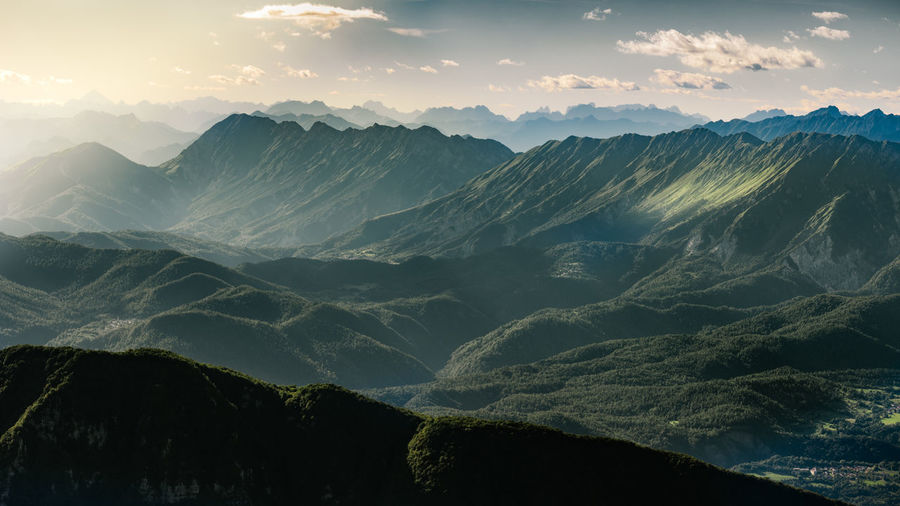 Scenic view of mountains against sky during sunset