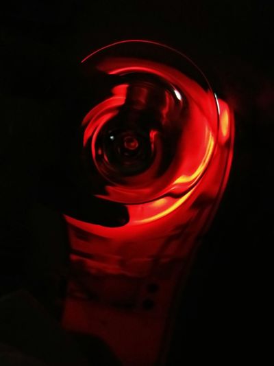 Close-up of red light against black background