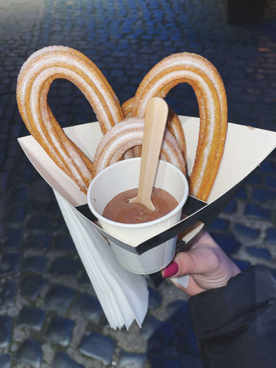 Holding tight my churros with chocolate