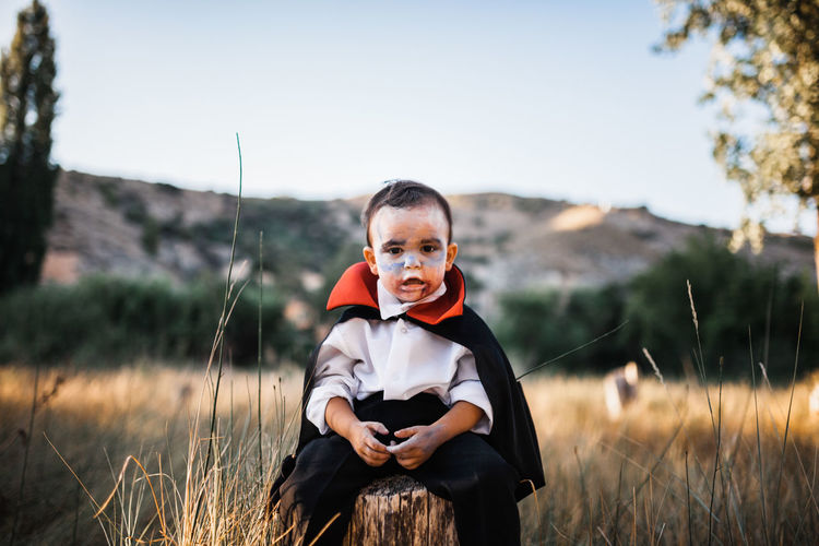 Portrait of boy on field